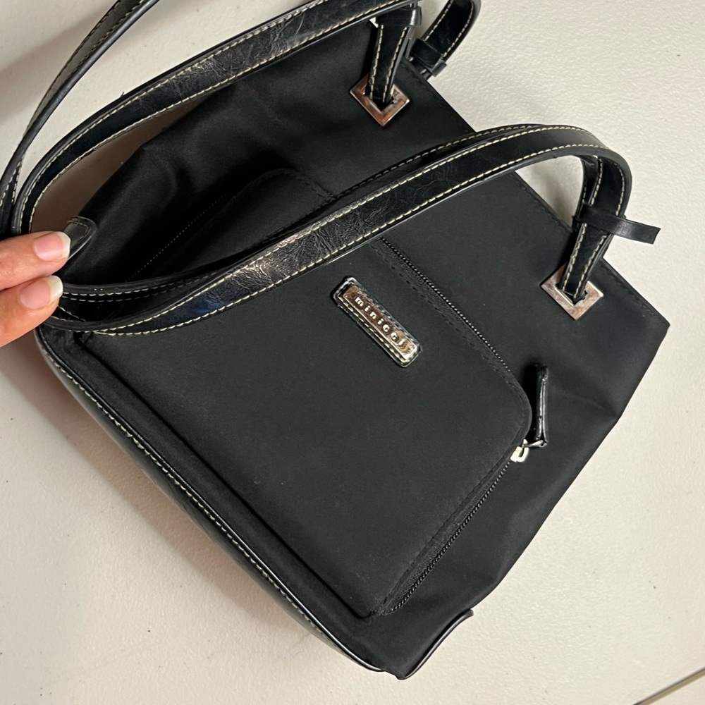 Mini Black adorned can go in shoulder under arm.